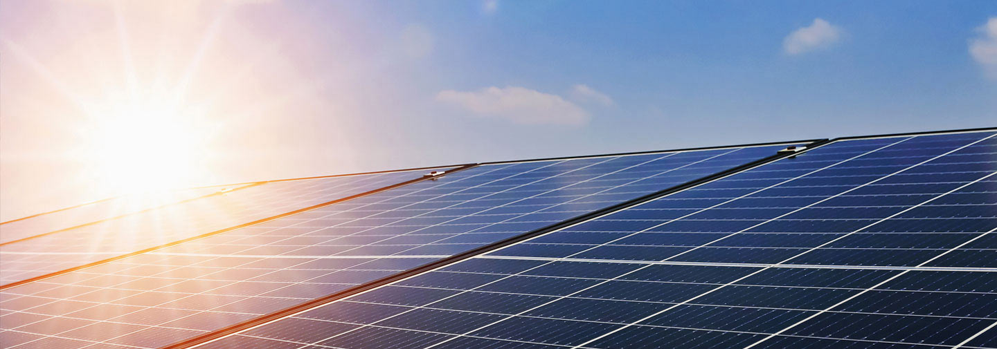 A row of solar panels in sunshine