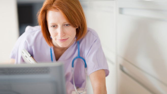 Nurse looking at computer 