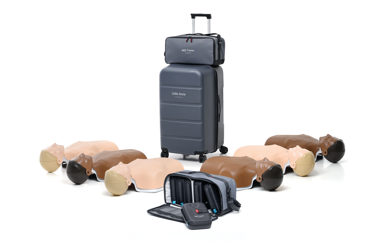 New Little Anne CPR torso manikins in light and dark skin tones with one gray carry case