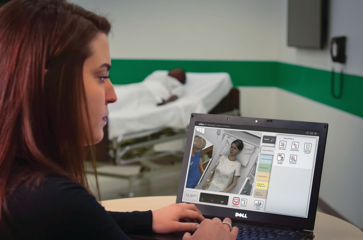 Woman using vSim for Nursing showing a 3D patient