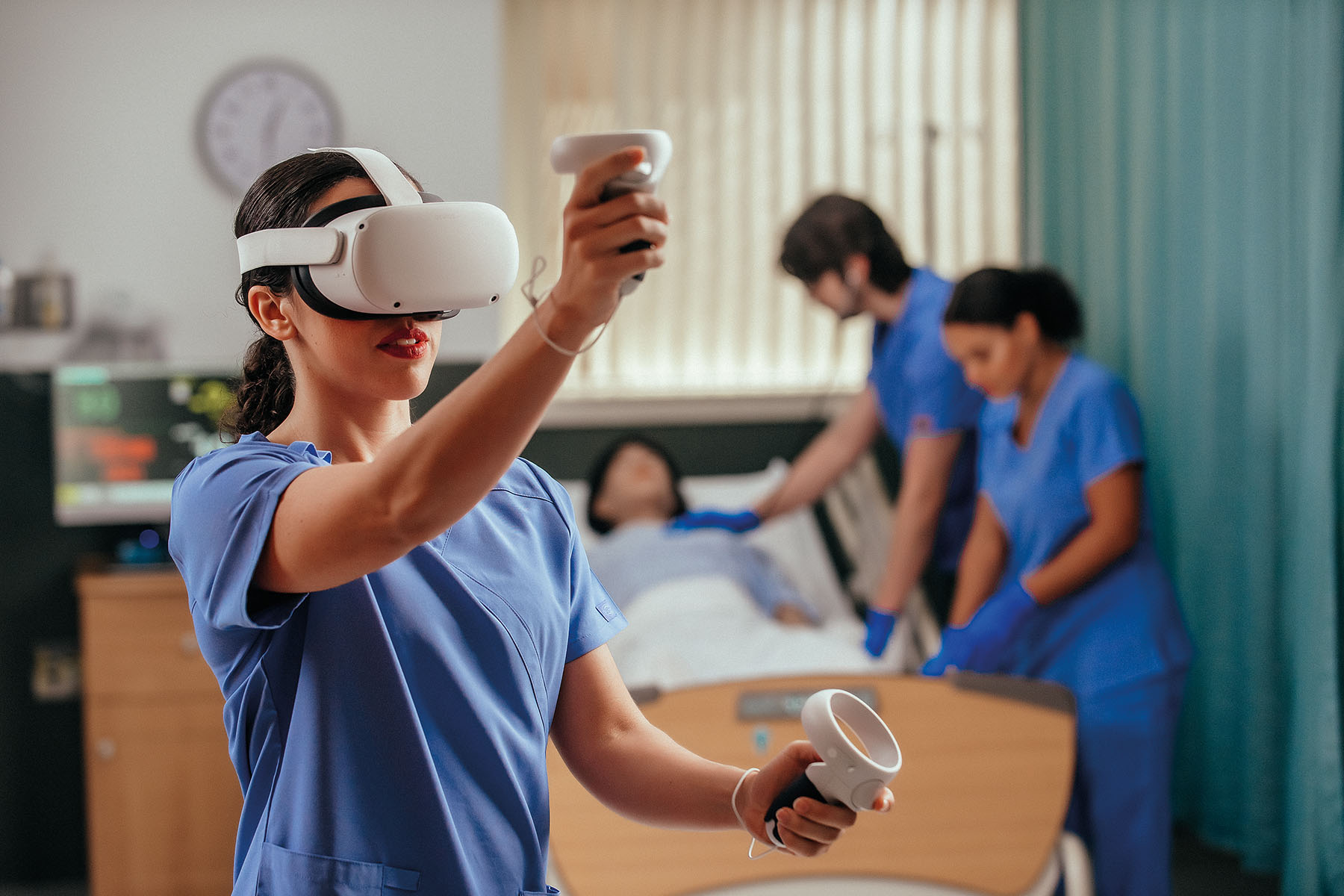 nursing student using vrClinicals in front of other students that are blurred in the background. 