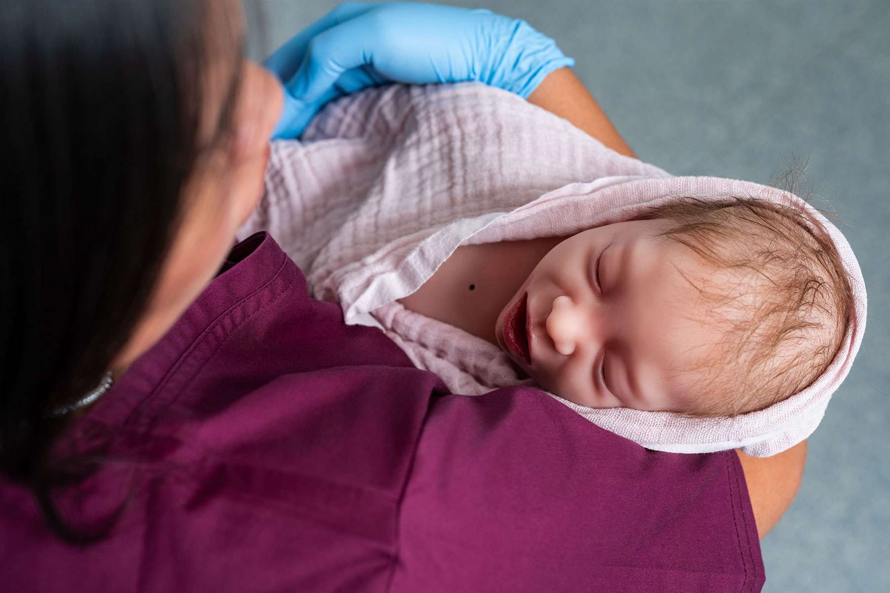 Nurse holding Emily