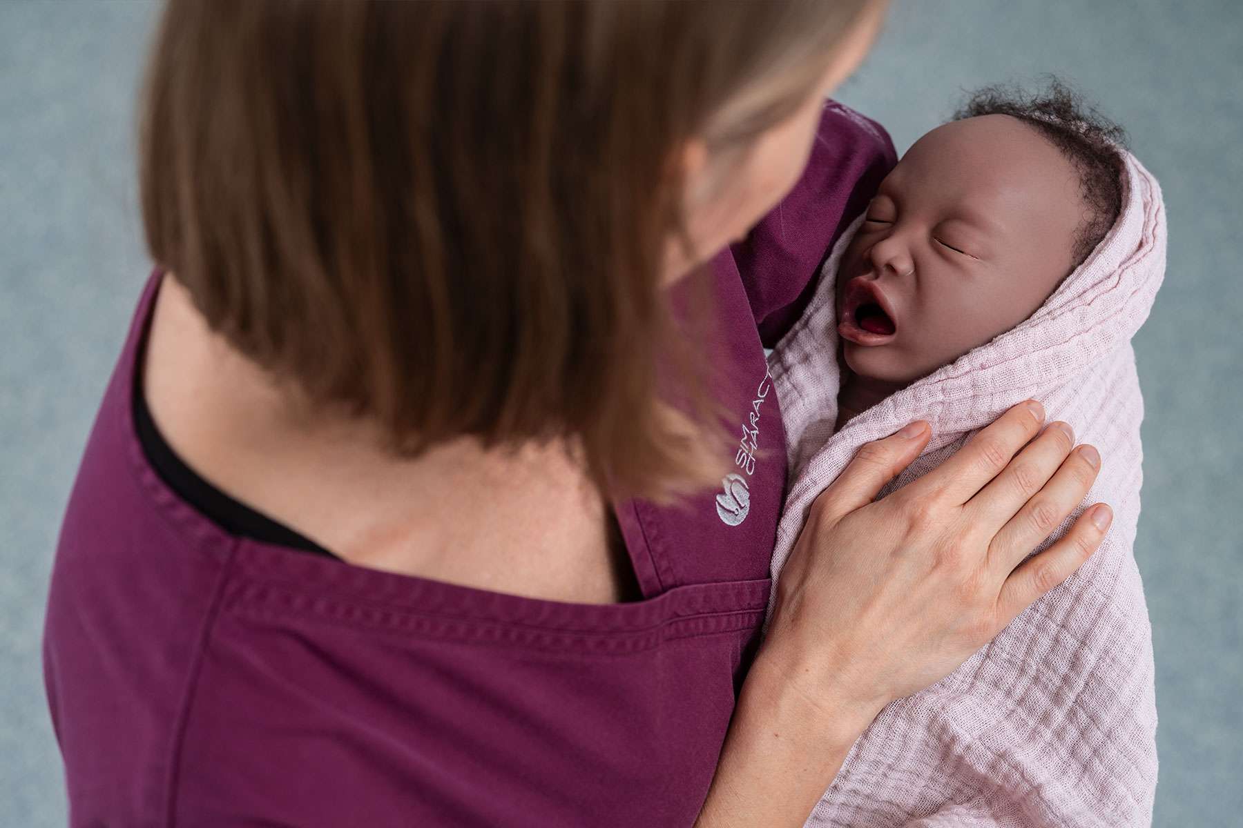 Nurse holding Emma