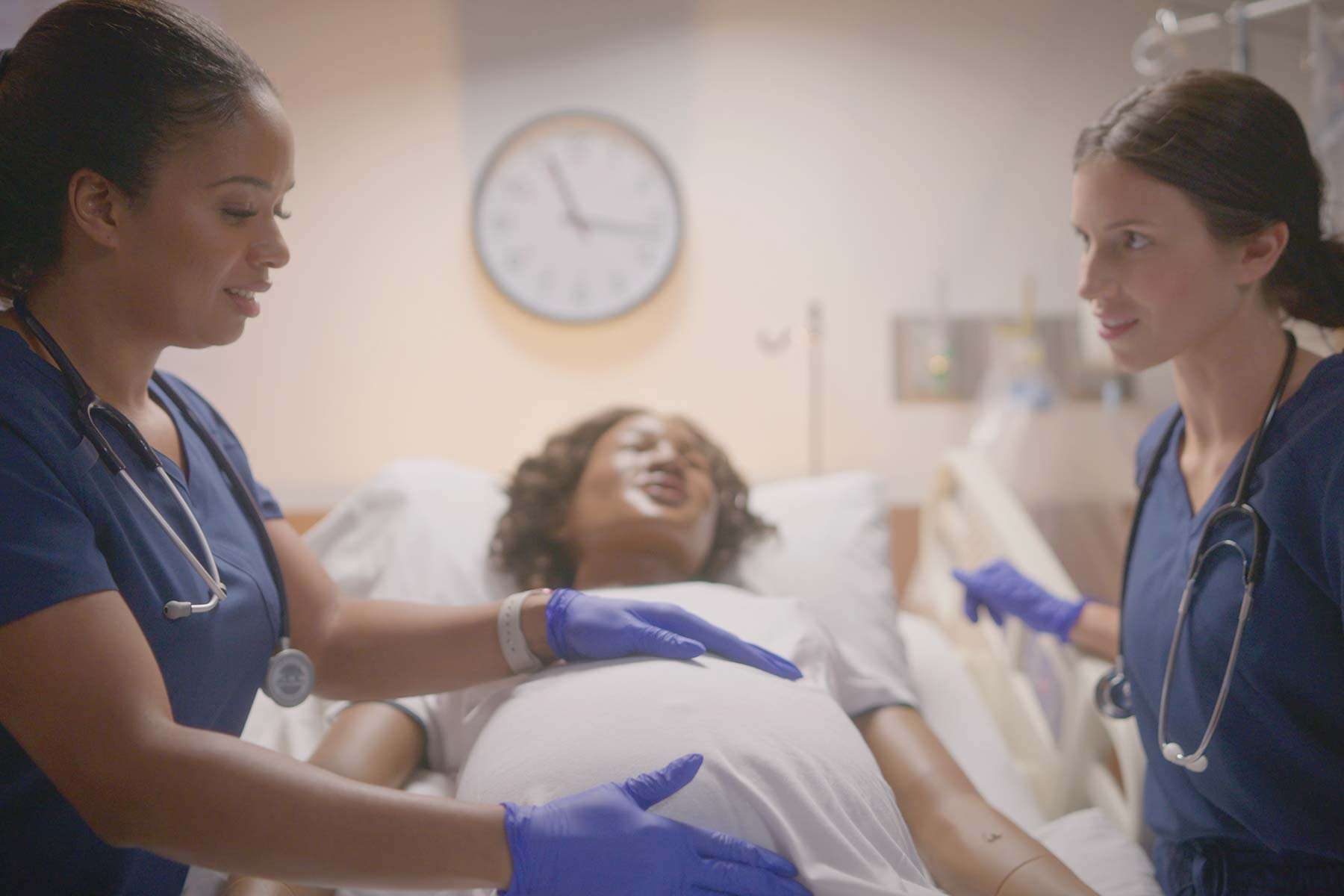 two nurses tending to mamaanne simulator