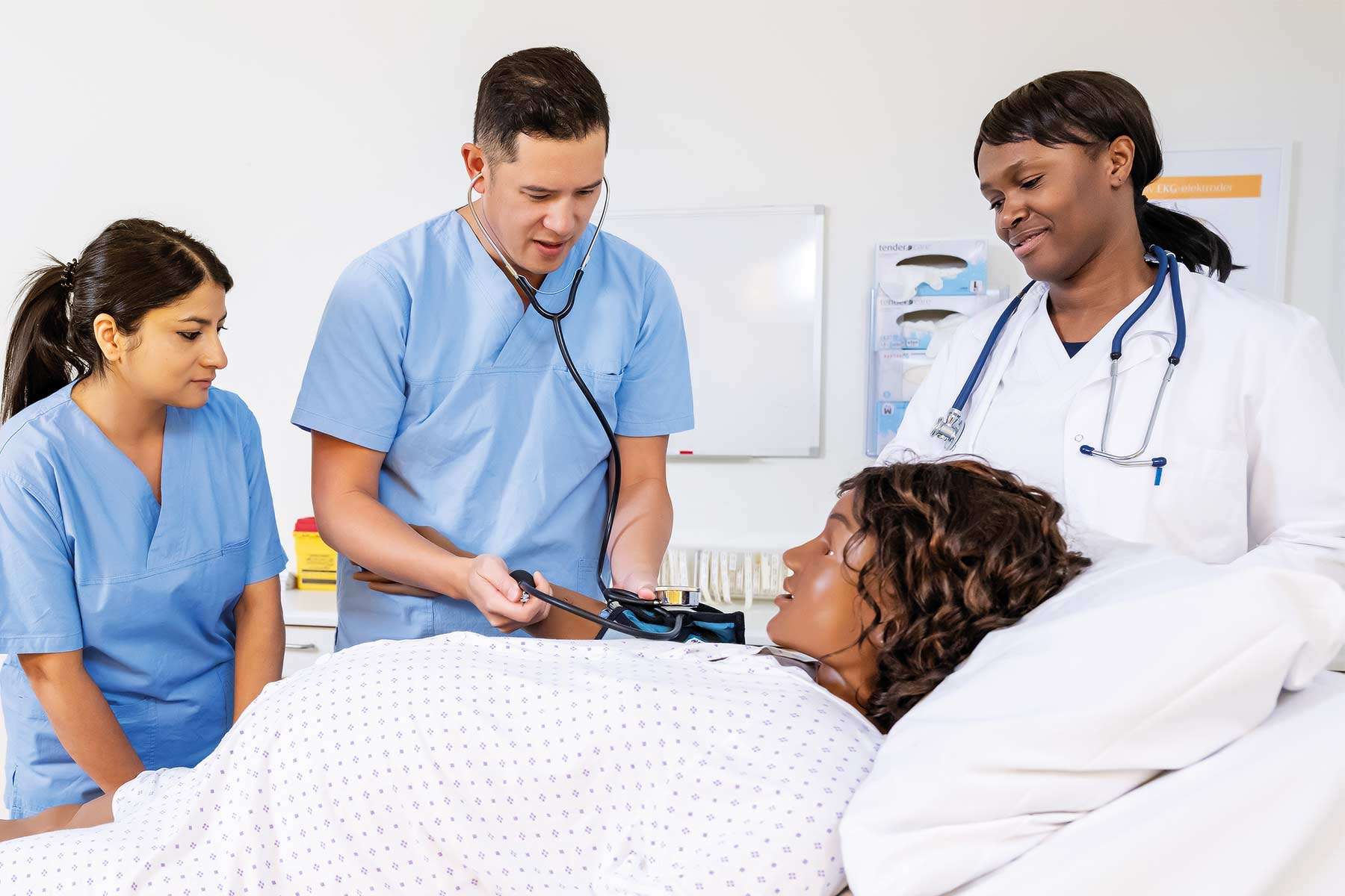 two nurses and doctor checking blood pressure of female patient mamaanne