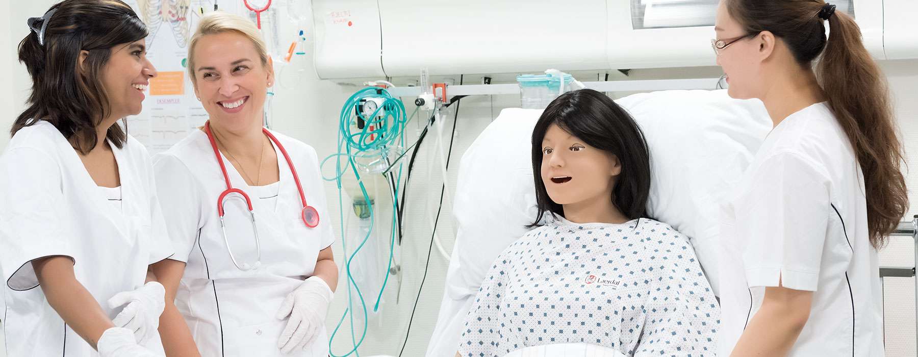 Nursing Anne Simulator with Nurses Smiling