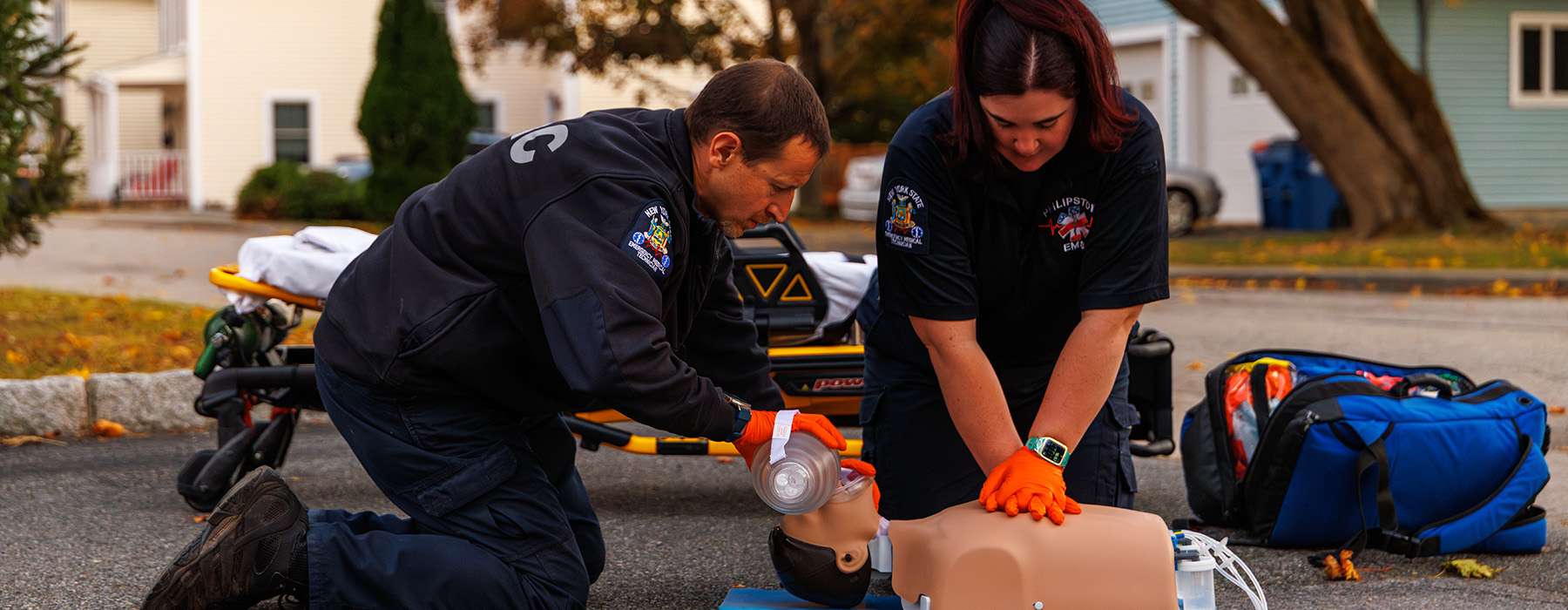 Emergency medical personnel practicing life-saving procedures using an advanced patient simulator.