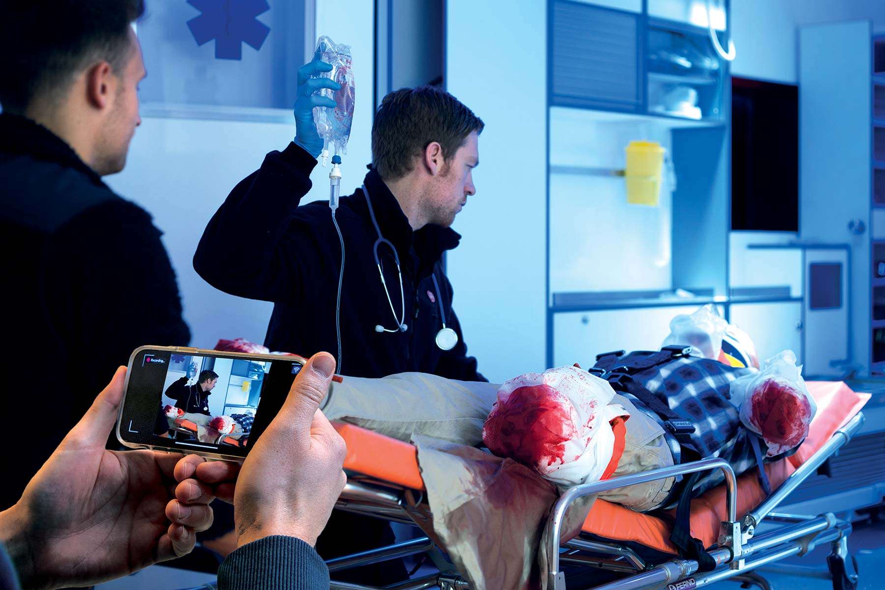 ems technicians using simcapture mobile with simman 3g trauma manikin