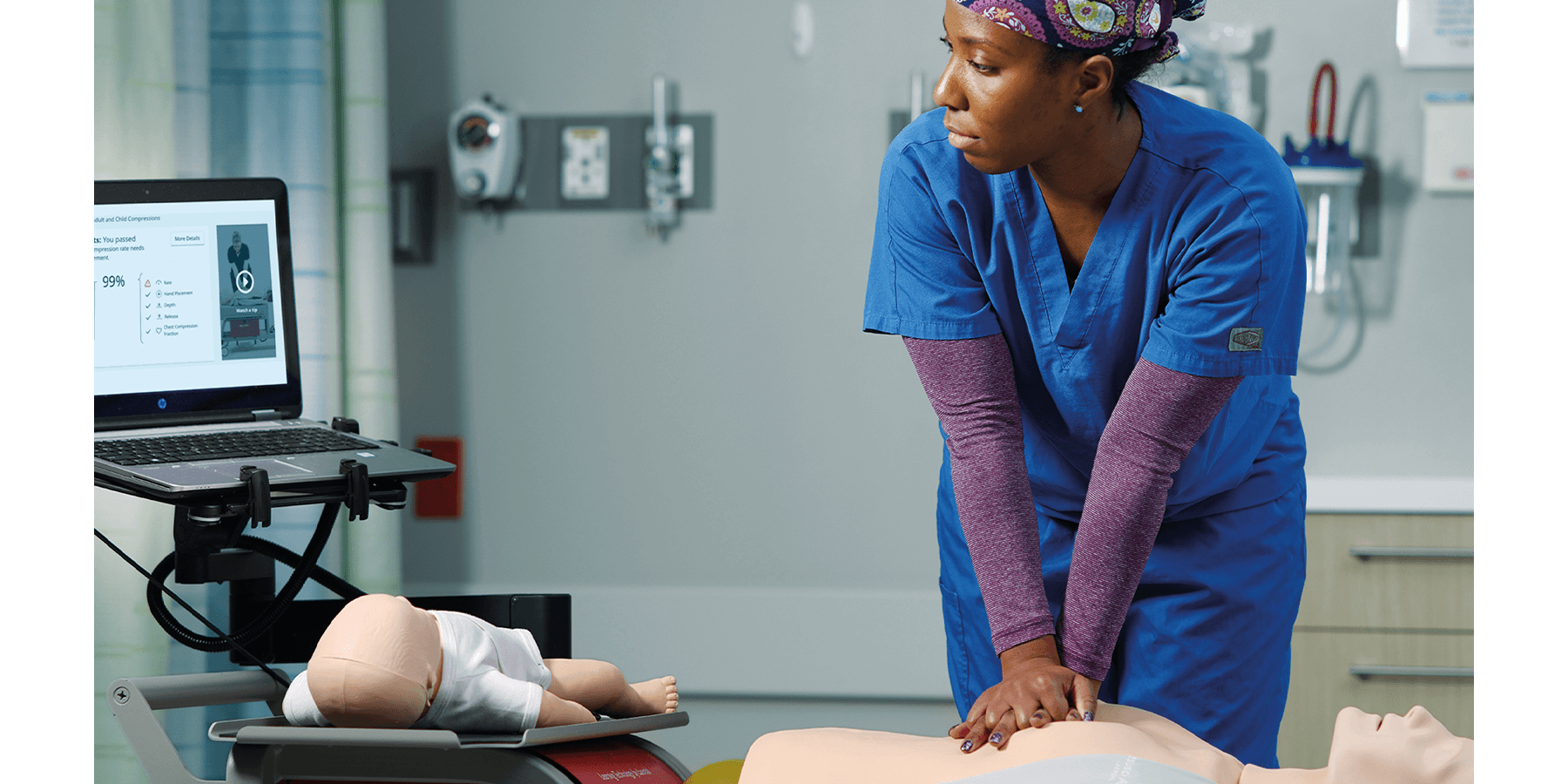 Female nurse doing CPR training. RQI.