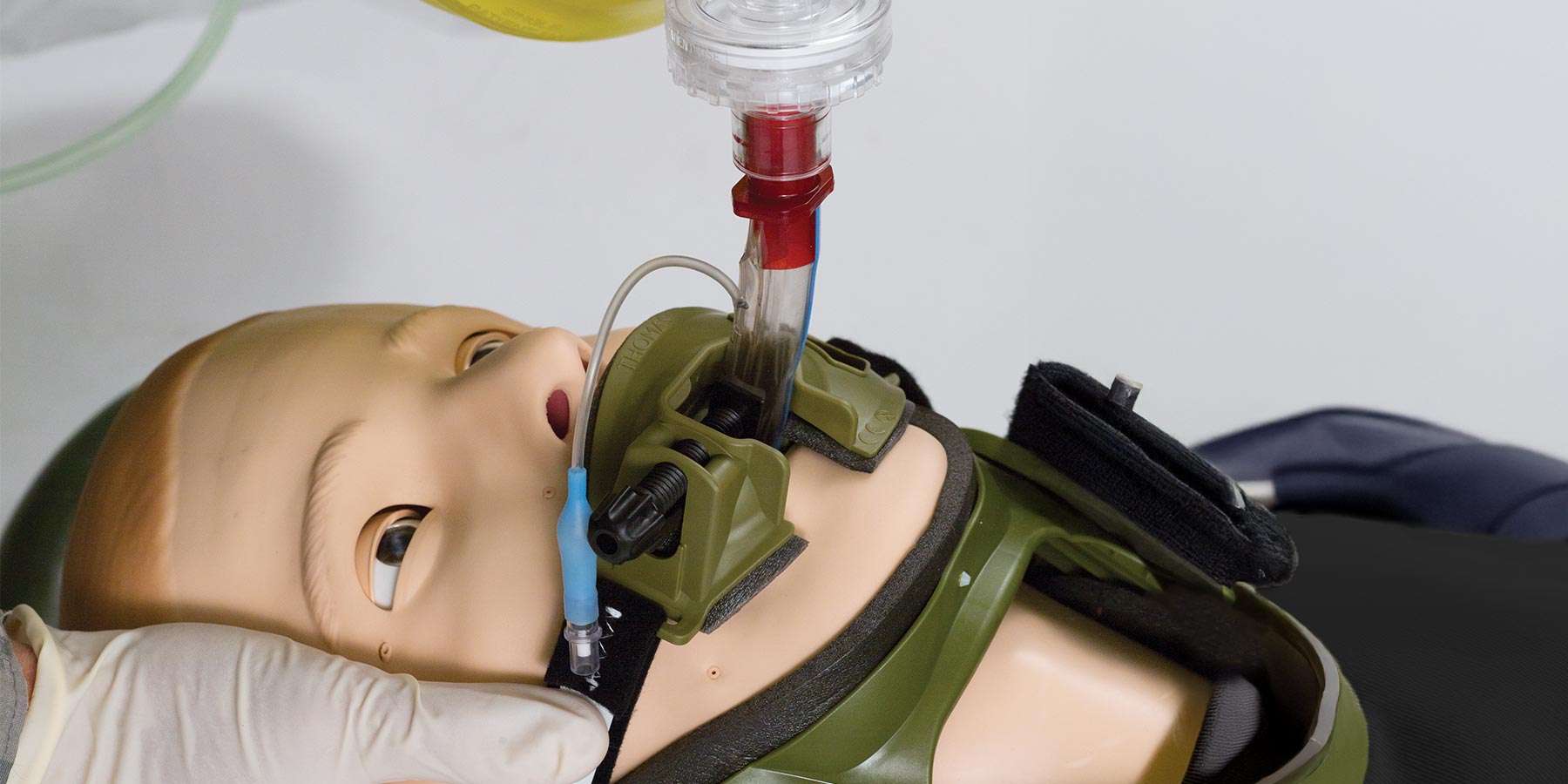 a bag valve masked being used with stifneck select on a simman trauma manikin
