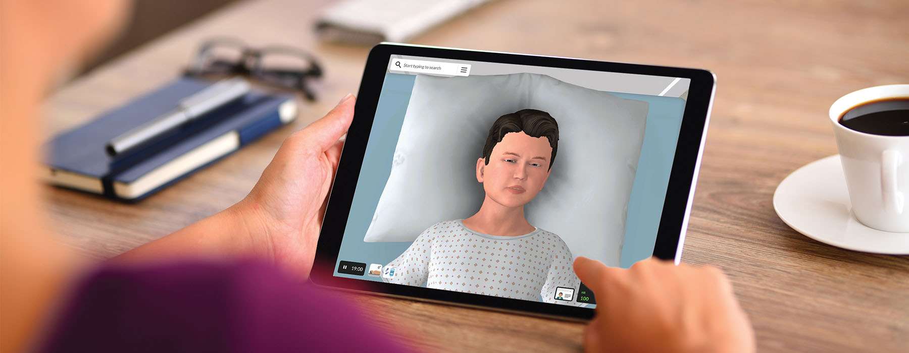 Back-view of someone holding a tablet showing a screen with NextGen vSim for Nursing Pediatric