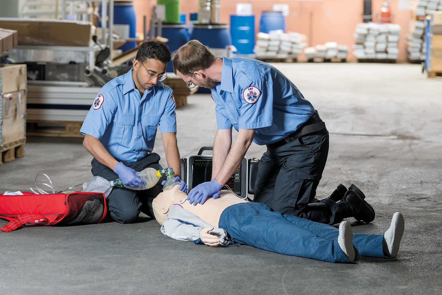 EMS workers doing CPR training on manikin using Monitor by Laerdal